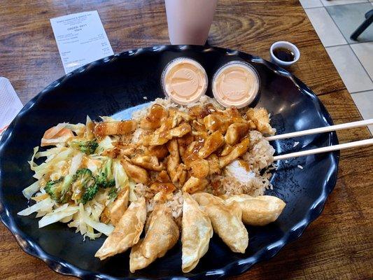 Hibachi chicken, veggies, and fried rice, with dumplings. And yum yum sauce.