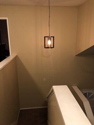 Swapped outdated light fixture with a hanging Edison bulb light fixture