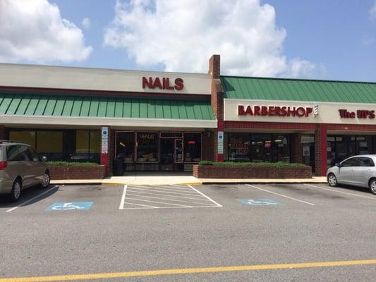 Front view, in shopping center with Shoppers tucked in a corner upfront.