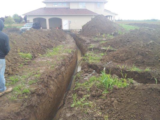 Trenches for the 4-ton Ground Heat Exchanger for this Geothermal Radiant Heat/AC system.