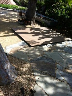 Flagestone patio with yoga deck made out of Trex deck 2 material.