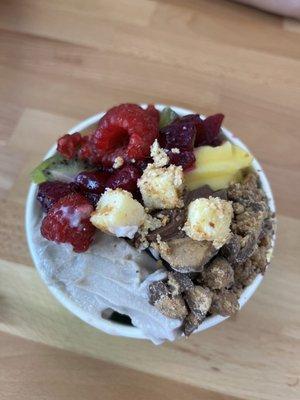 Mango, pineapple, chocolate, and cookies and cream yogurt with dragon fruit, raspberry, cheesecake, and Reese's toppings