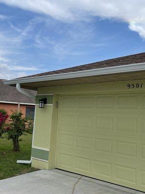 Clean white gutters that go all around the house....as they should.