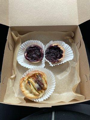 Apple Cinnamon, Blueberry, and Boysenberry mini pies.