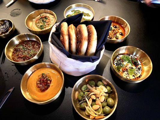 The Seven Salads (Olives, Zaalouk, Muhammara, Lebni, Bissara, Tomato Jam, Cucumber) with Za'atar Flatbread