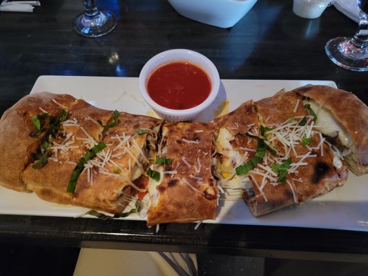 Meatball, pepperoni and bacon calzone