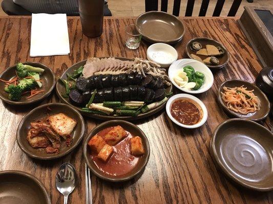 soondae (blood sausage) and bossam (sliced pork) platter as well as vegetable sides (banchan)