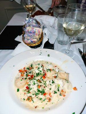 Crabmeat & Scallops Sautéed in olive oil, green onions, and red peppers with a cream sauce served over pasta