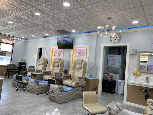 Three of 8 comfortable massage chair stations for pedicures.