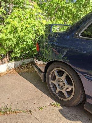 Rear cover reattached at quarter-panel and painted Subaru midnight pearl black