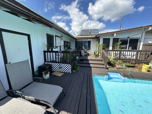 Pool deck, lattice, outdoor shower, siding, exterior doors