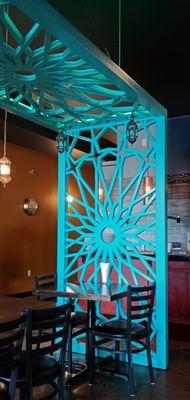 Lovely arbor providing visual interest and some virtual separation for diners.