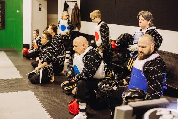 Our teen and Adult Hapkido students getting prepped for sparring.