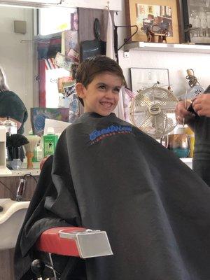 My six-year-old actually laughing while gettin his hair cut.  Thanks, Cally!