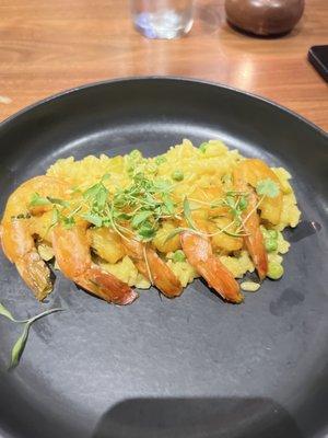 Sautéed shrimp over saffron risotto. $34.