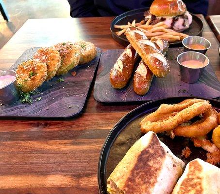 Fried green tomatoes, soft pretzels, steakhouse burger with fries, garbage plate wrap with delicious onion rings!