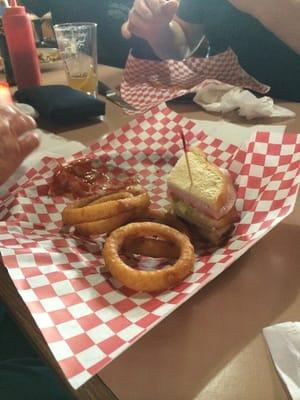 Club sandwich and onion rings.