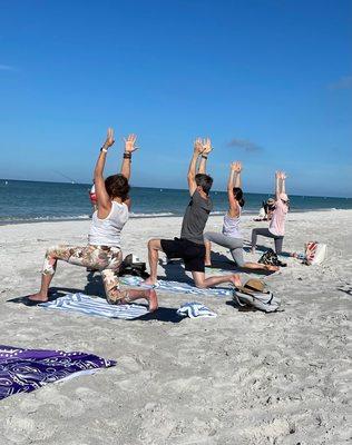 Beach yoga, raise your hands if you are having fun!