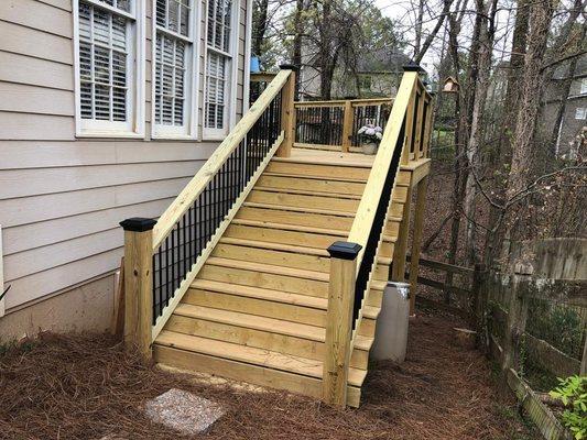 From Vision to Reality: Transforming Backyards in North Atlanta, GA! . A stunning deck with garden stairs.