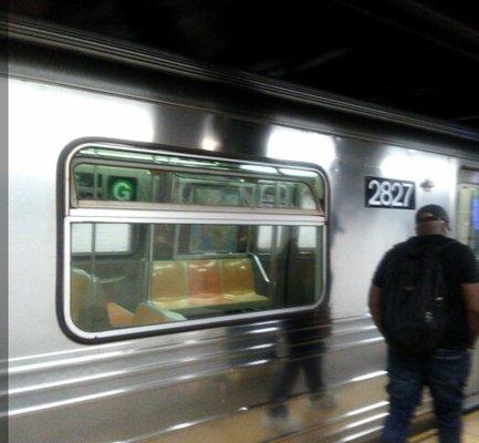 The G - Train arriving at Metropolitan Avenue Train station . a heading towards Bedford -Nostrand Ave . Church Avenue ( last stop )