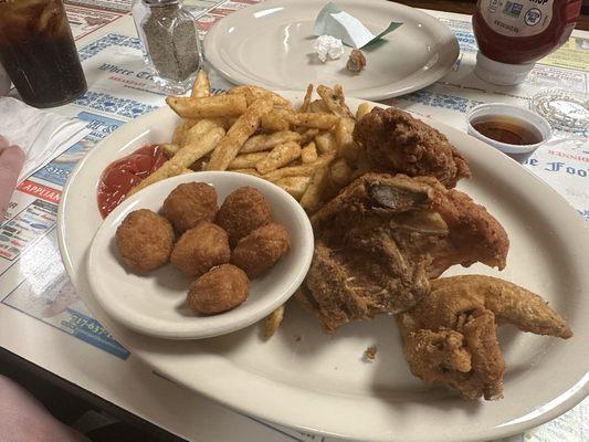 Jodi special chicken with fries and corn fritters.