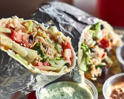 Carnitas burrito with pico de gallo, corn, grilled fajita veggies, romaine lettuce, cilantro lime rice and creamy jalapeño.