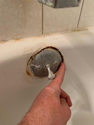 Completely rusted through bathtub overflow plate