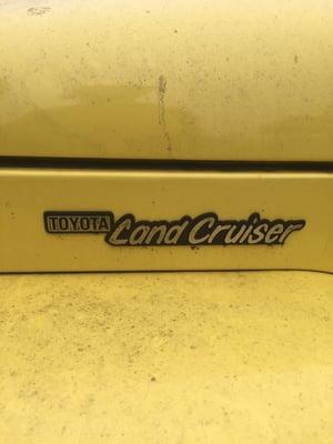 A land cruiser Toyota posted at the shop...