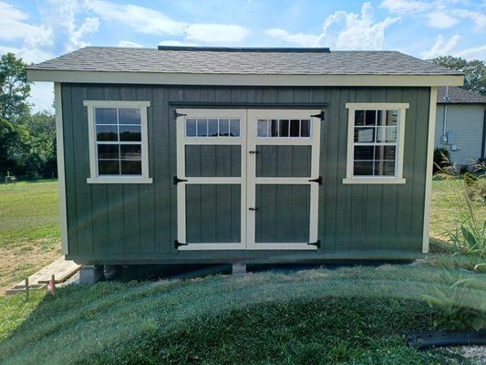 Front of 12'x16' Premium Garden Shed with transom windows on double door.