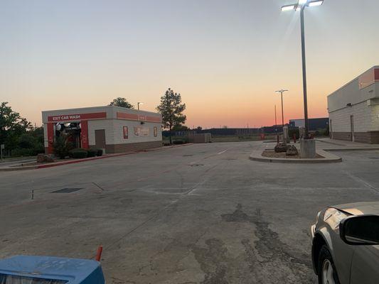 Car wash on the left and what looks like a vacuum station next to it