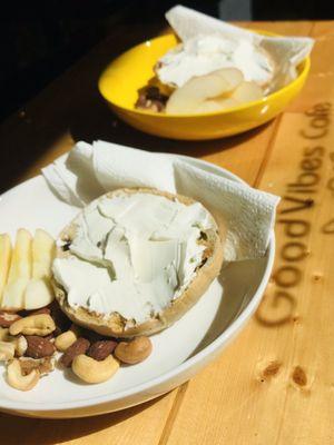 Raisin Bagel with Cream Cheese, side of fruit and nuts.