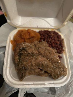 Smothered pork chop with red beans and rice plus yams.  So good!