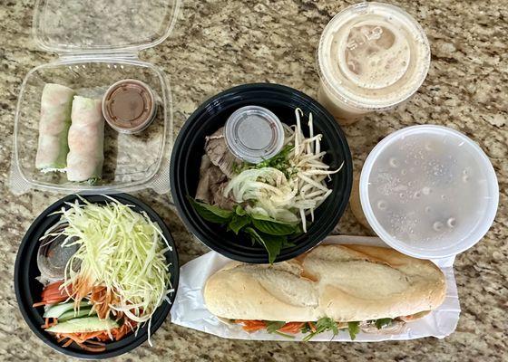 Shrimp rolls, beef pho, mango tea, veggie rice, and chicken banh mi