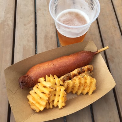 Corn dog, waffle fries, and Sweet Water