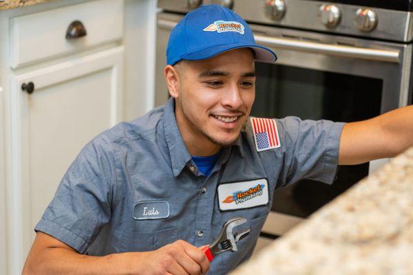 Our plumber, Luis!  He's very photogenic!