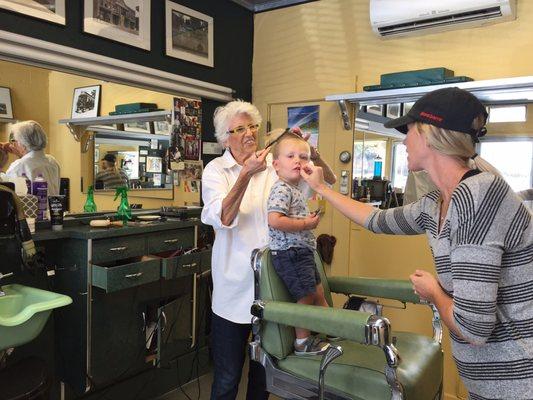 The calmest and most well- behaved toddler I've ever seen getting his hair cut!