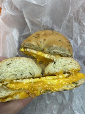 Egg and cheese on spinach cheese bagel