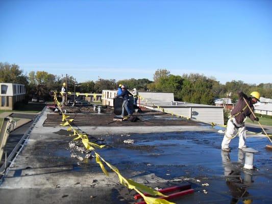 This is a picture of the existing roof at Saint James Apartments in Dallas.  We removed this roof down to the deck and replac...