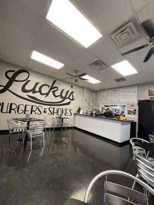 Lucky's! Dining area. Easy to read menu. Homemade sauces, charbroiled burgers. Can't lose.