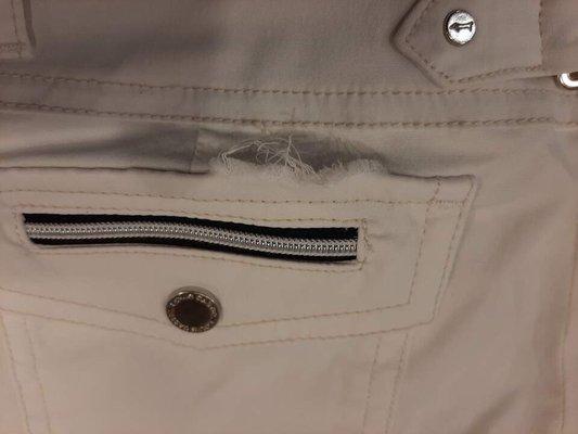 Poorly stitched pocket compartment