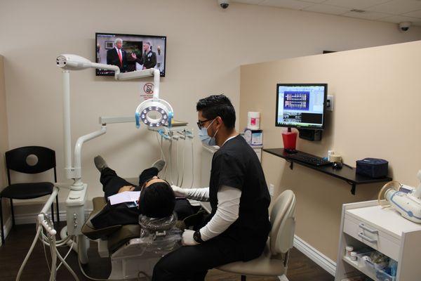 Our wonderful Dental Assistant Armando with one of our lovely patients