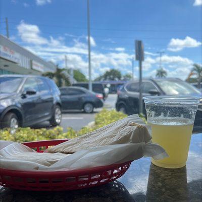 Fresh pineapple juice and a Pan con Bistec