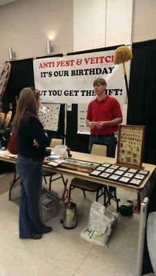 Jason Veitch running an information booth at a local event.