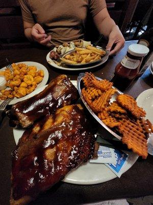 Full rack of ribs with sweet potato fries- Delicious and nicely seasoned. Meat fell right off the bones. Fries were nice and crunchy.