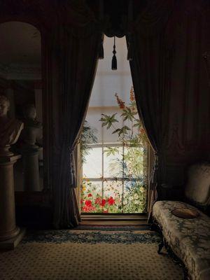 A painted window shade in the first floor salon