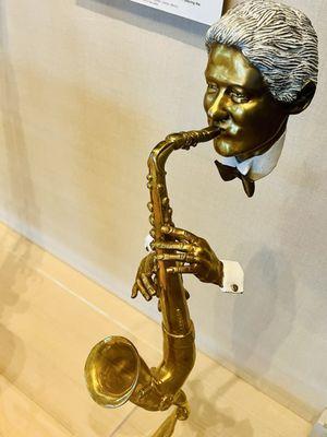 Art installation of Clinton playing the saxophone.