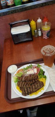 Lamb gyro platter over rice and greek salad. Arnold Palmer