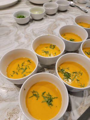 Carrot soup infused with ginger, lemongrass, and coconut milk