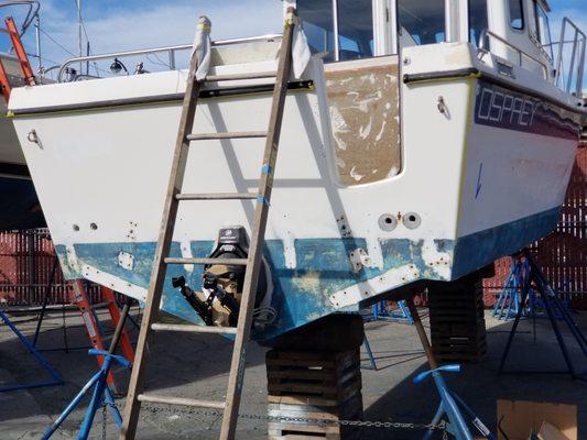 Had a deck removed and repaint the transom and reinstall a different swim deck. Forever to complete this at a cost, top corner primer still!