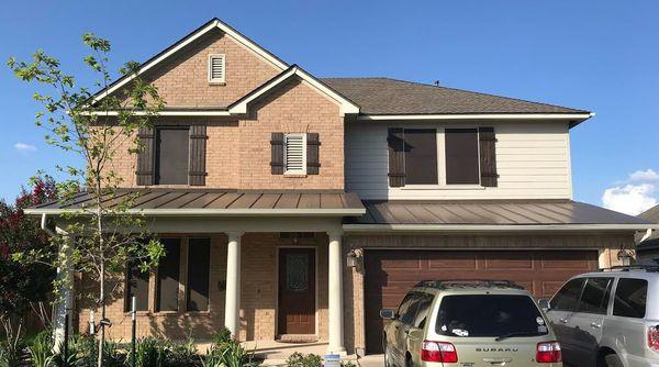 New roof with metal portions on the front patio and garage.